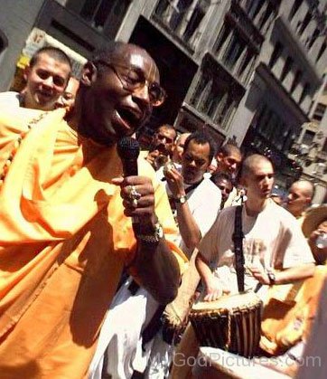 Bhakti Tirtha Swami Holding Mic