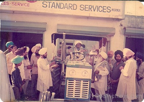 Image Of Baba Ji Sitting On Tractor