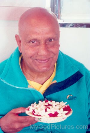 Sri Chinmoy With Flowers