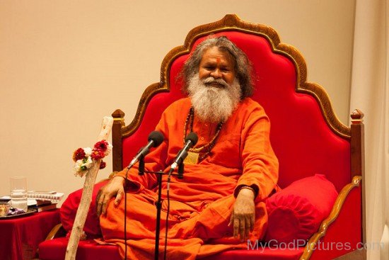 Swami Maheshwarananda Sitting On Sofa