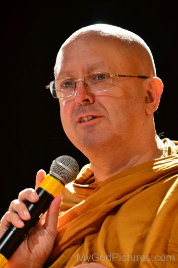 Ajahn Brahm Holding Mic