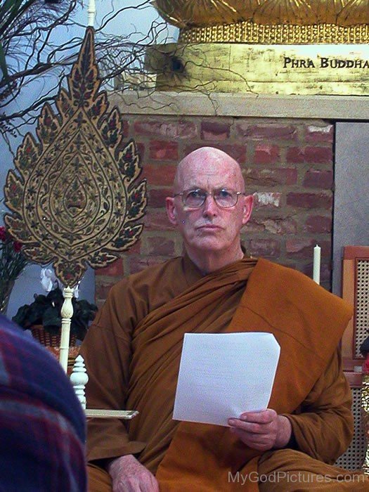 Ajahn Sumedho Holding Paper