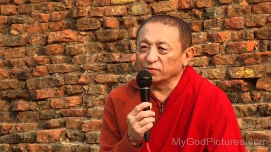 Chokyi Nyima Rinpoche Holding Mic