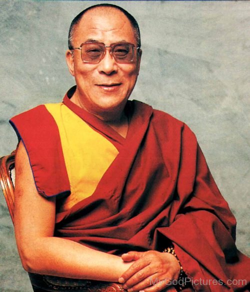 Dalai Lama Sitting On Chair