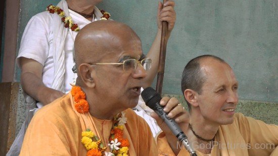 Gopala Krishna Goswami Holding Mic