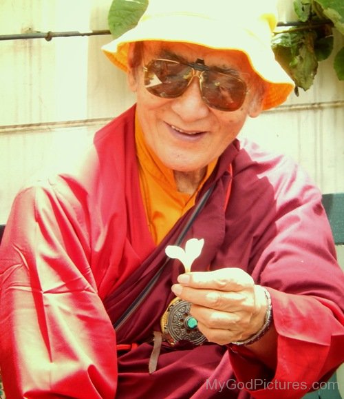 Karma Thinley Rinpoche Holding Flower