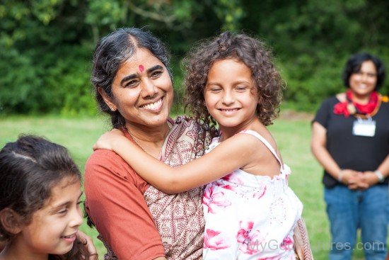 Mother Meera Holding Child