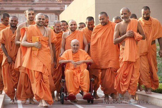 Pramukh Swami Maharaj On Wheel Chair With Devotees