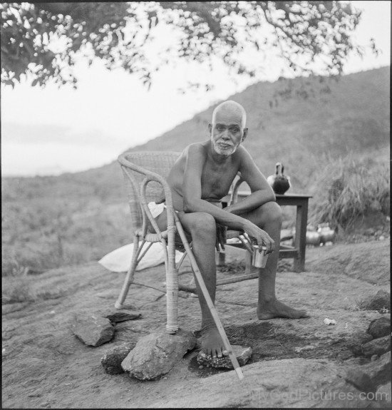 Ramana Maharshi Holding Glass