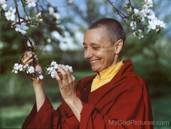 Tenzin Palmo Holding Flowers
