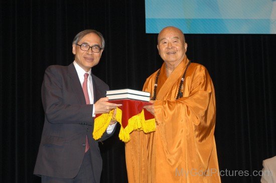 Hsing Yun Receiving Book From Lawrence J.Lau