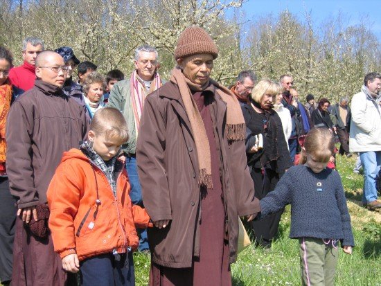 Thich Nhat Hanh Holding Children's Hand