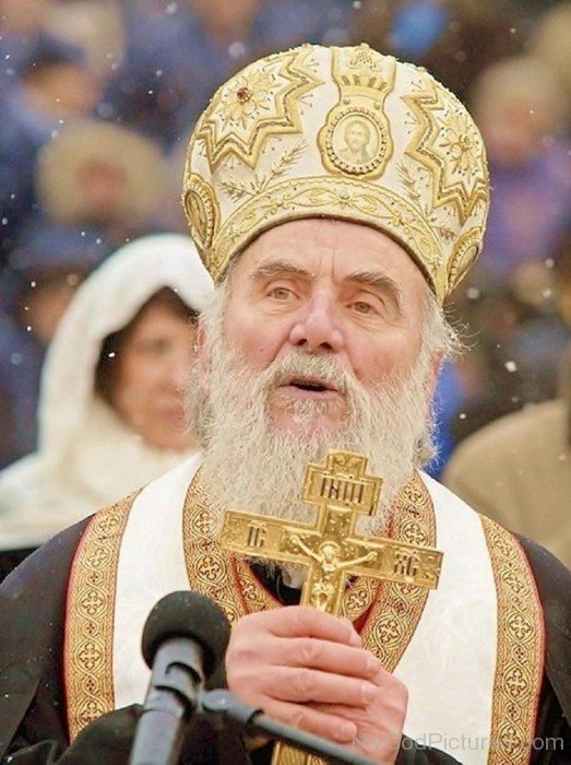 Bishop Irinej Holding Cross